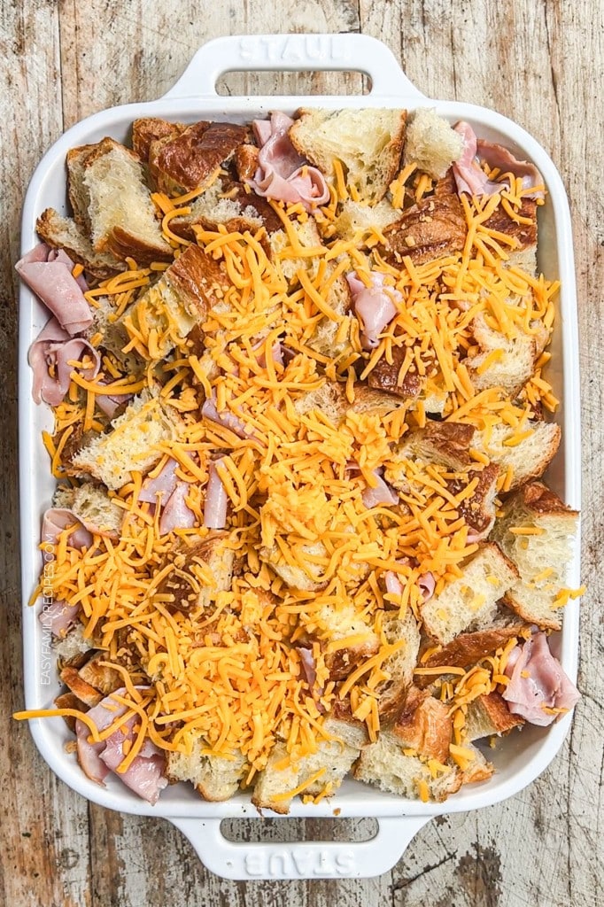 Overhead view of Ham & Cheese Croissant Breakfast Casserole before baking