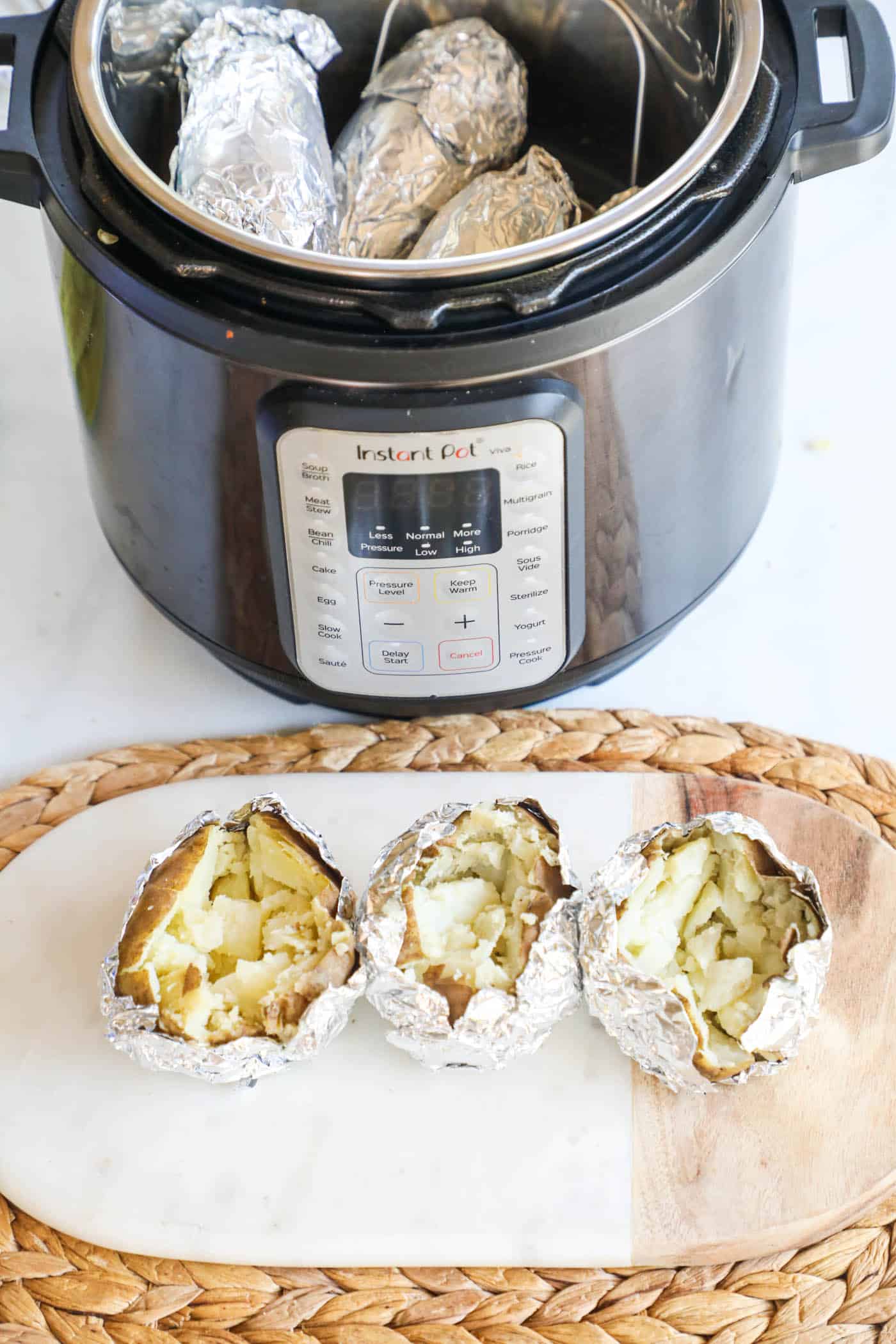 Baked potatoes next to an instant pot