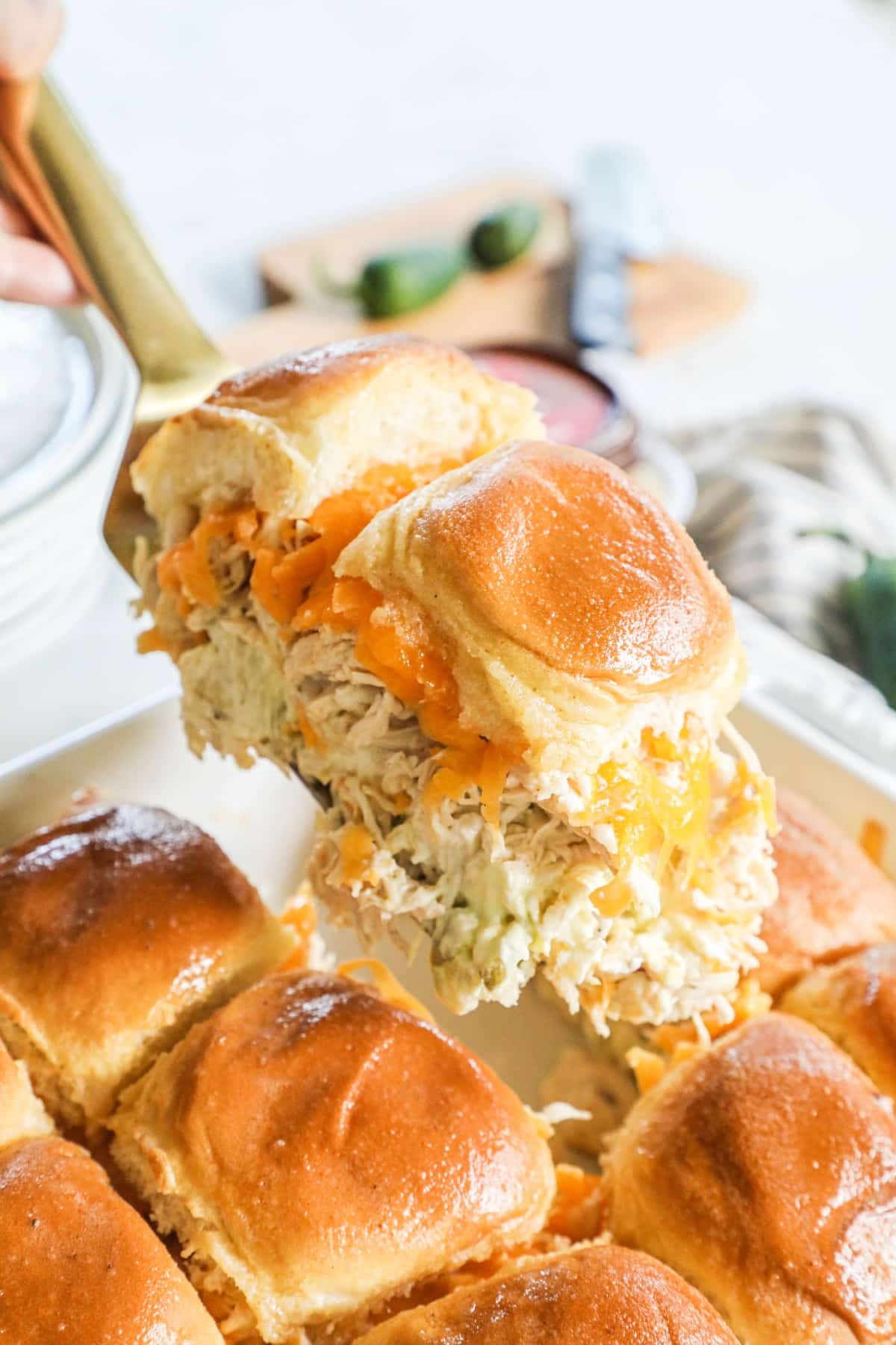 An image of shredded chicken jalapeno flavored sliders on hawaiian rolls