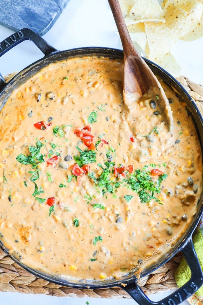 Queso Dip loaded with leftover taco meat, black beans and corn