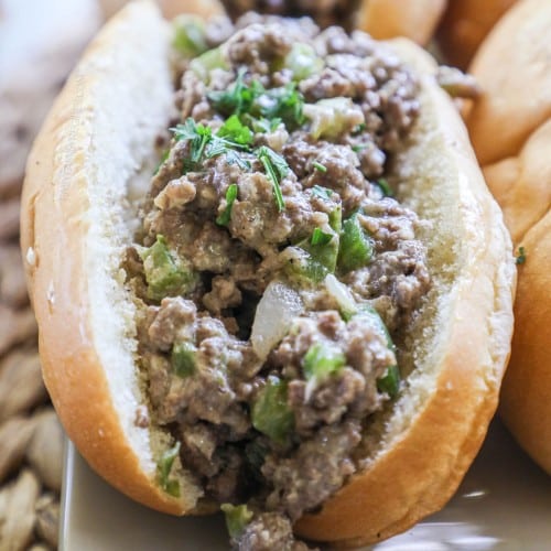 a split hoagie roll loaded with cheesy ground beef and bell pepper mixture.