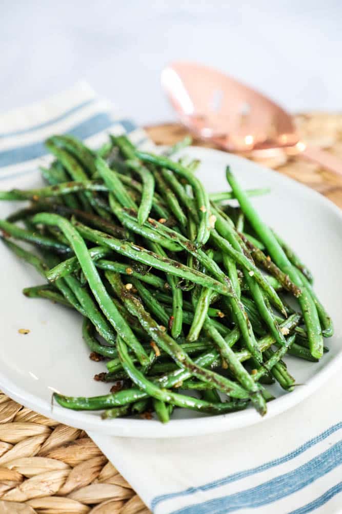 roasted green beans on a plate