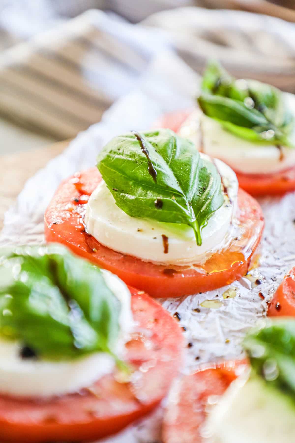 Caprese - red tomato with mozzarella and basil on top 