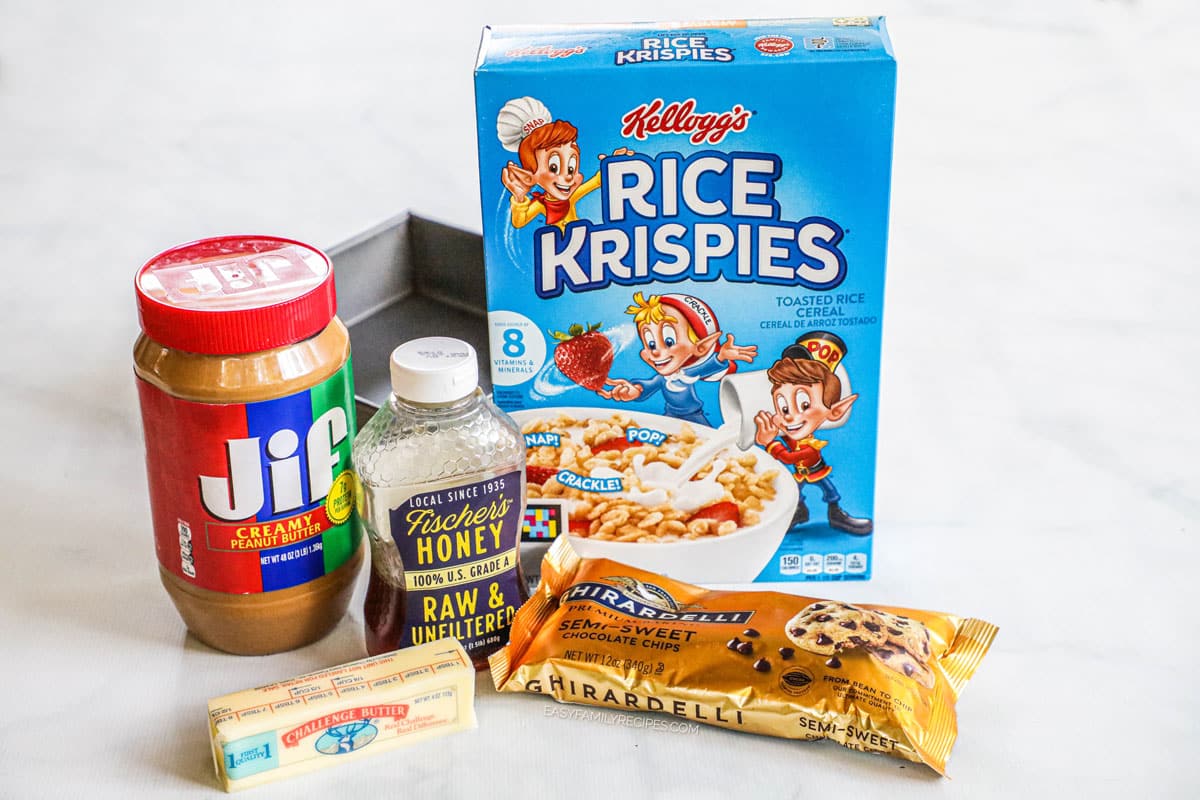 Ingredients for dark chocolate crunch bars, including peanut butter, honey, butter, rice krispies, and chocolate chips