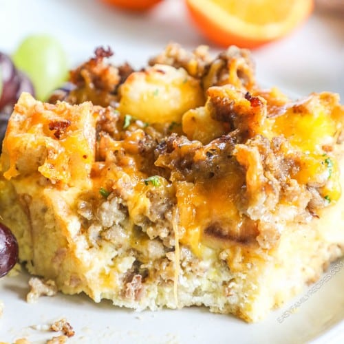 a square of english muffin breakfast casserole on a plate.