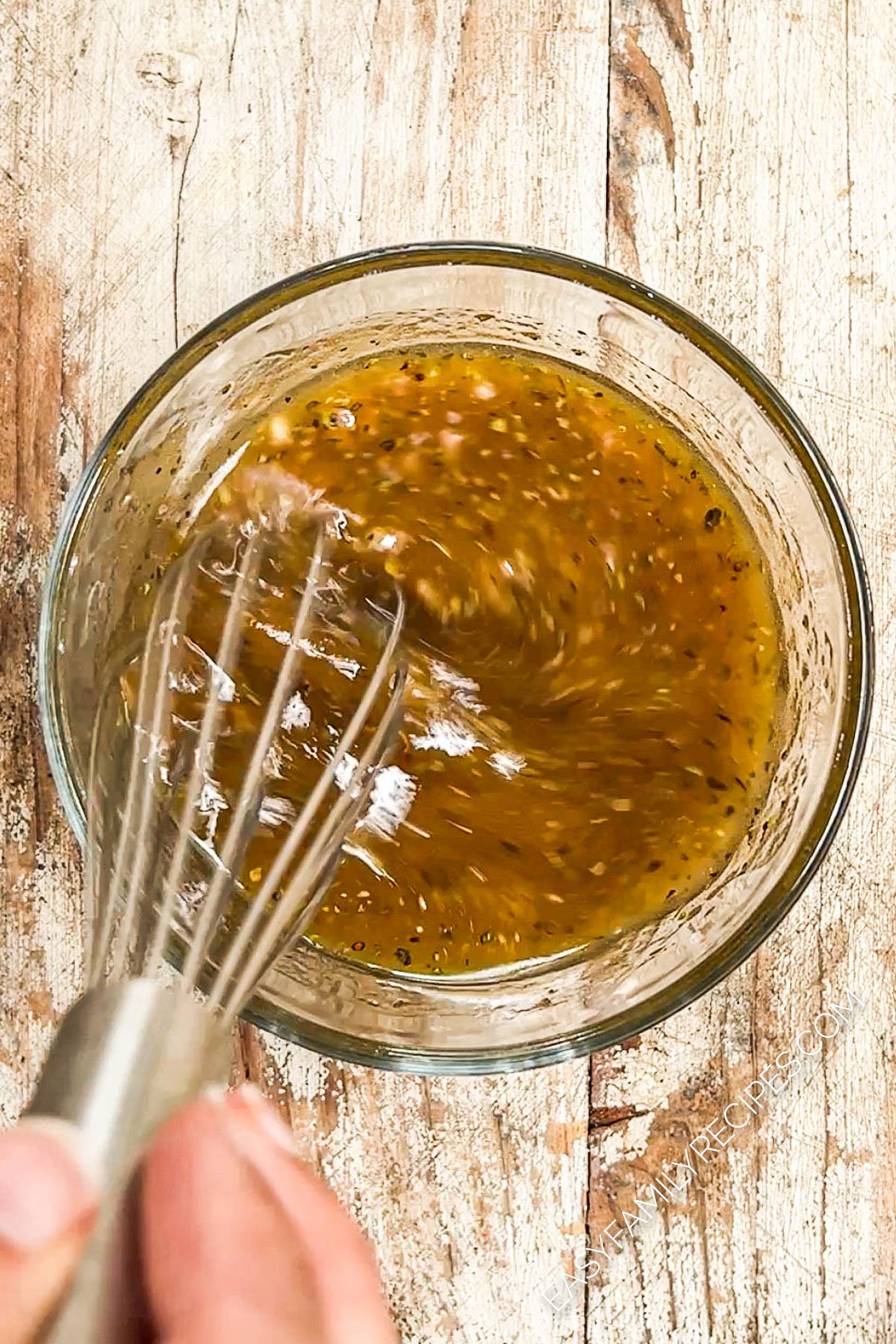 arugula pear salad dressing in a bowl.