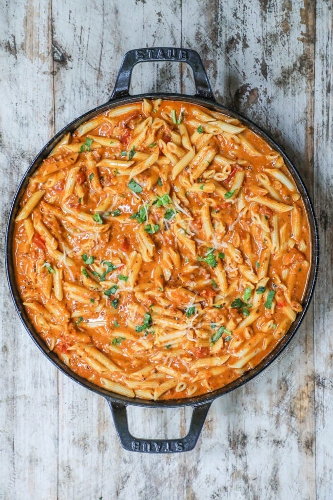 Overhead view of creamy chorizo pasta in cast iron skillet