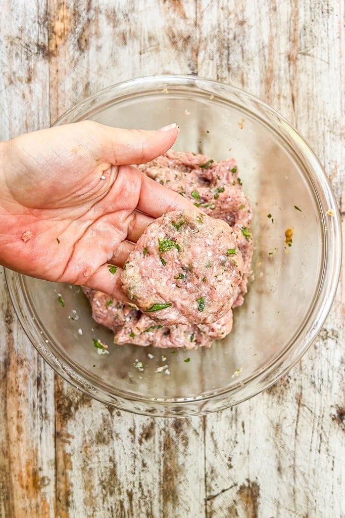 Hand shaping ground turkey into patties