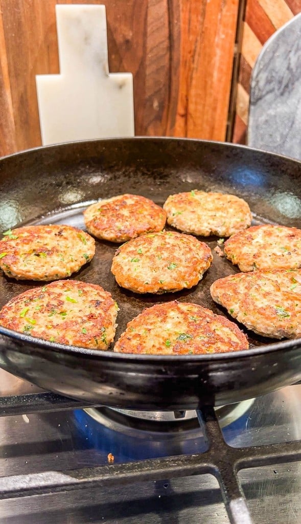 Cooking turkey patties in a skillet on the stovetop