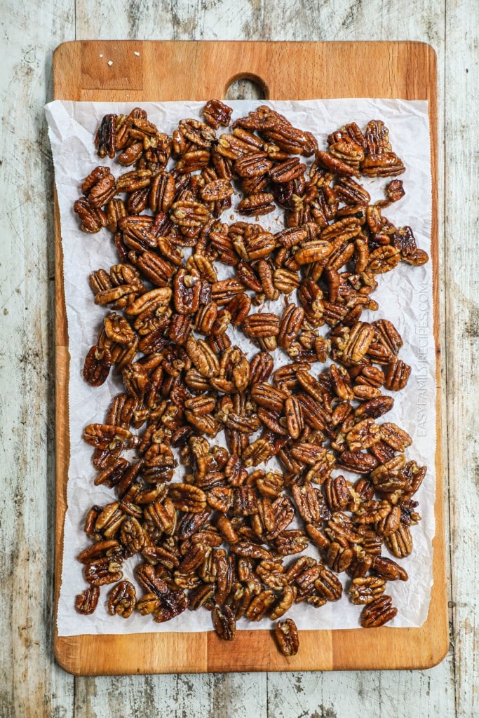 pecans cooling on a piece of parchment paper from above.