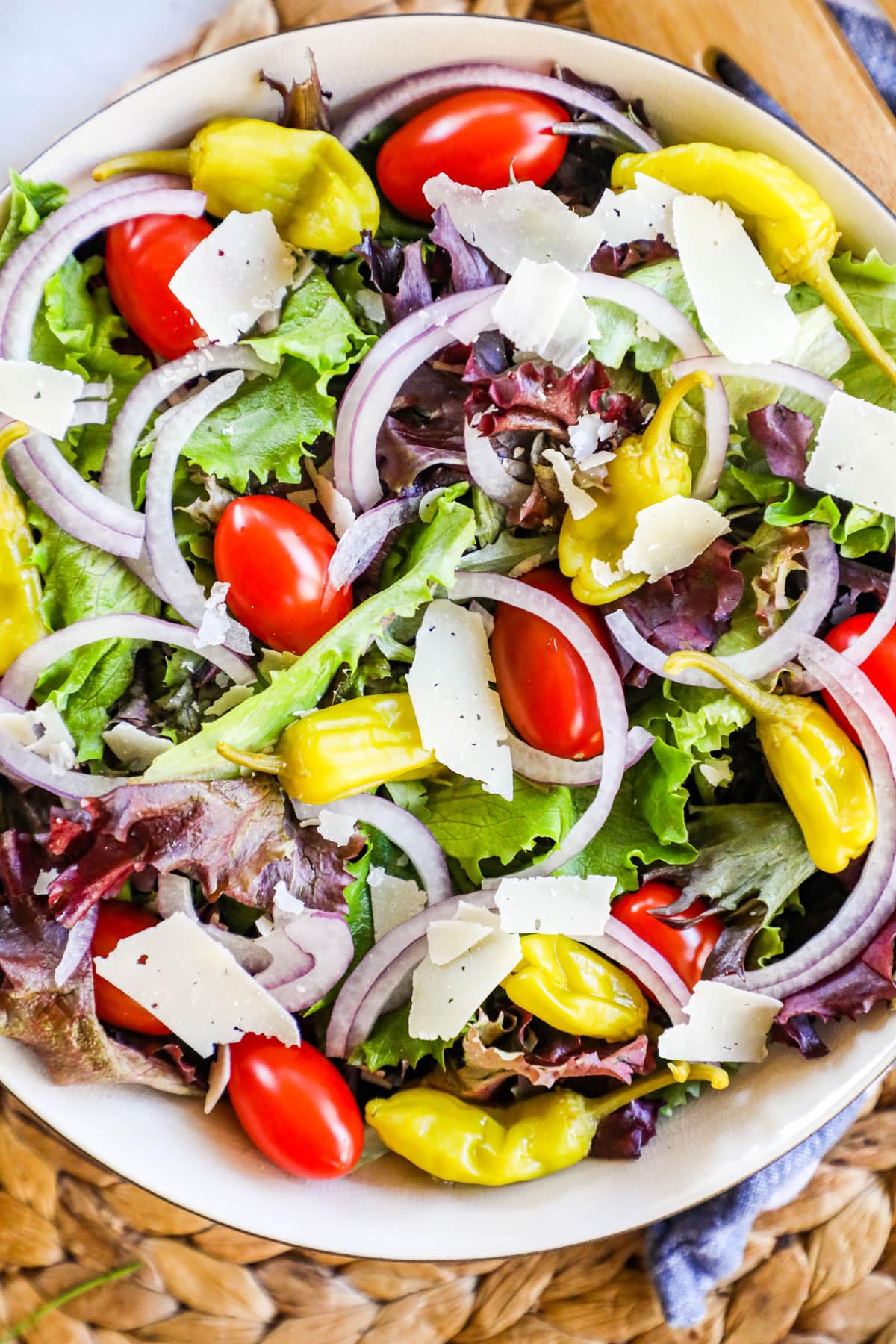 House salad to with tomatoes, red onion, pepperoncini, and parmesan