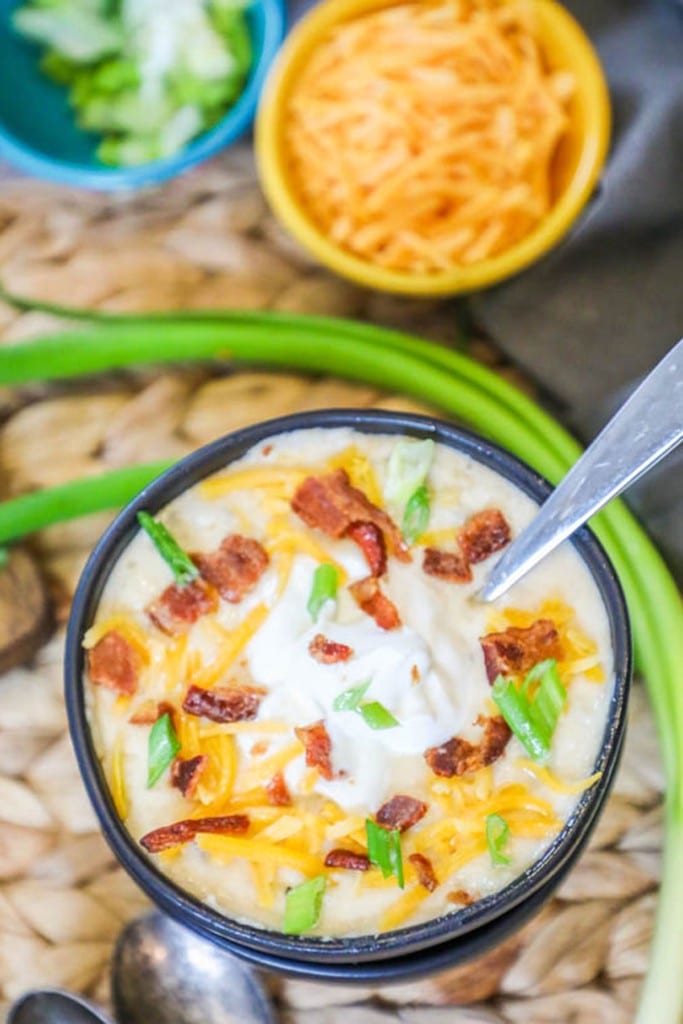 Loaded Baked Potato Soup topped with bacon and sour cream to serve with Prime Rib as a side dish