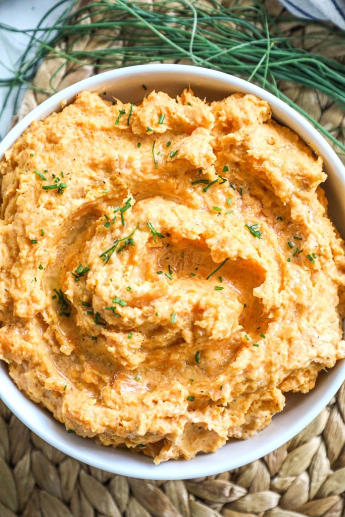 Savory mashed sweet potatoes ready to be served with Ham for Christmas Dinner