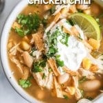 Overhead view of Southwest white chicken chili in bowl with garnishes