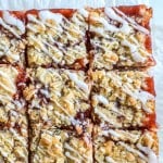 Overhead view of strawberry bars with glaze