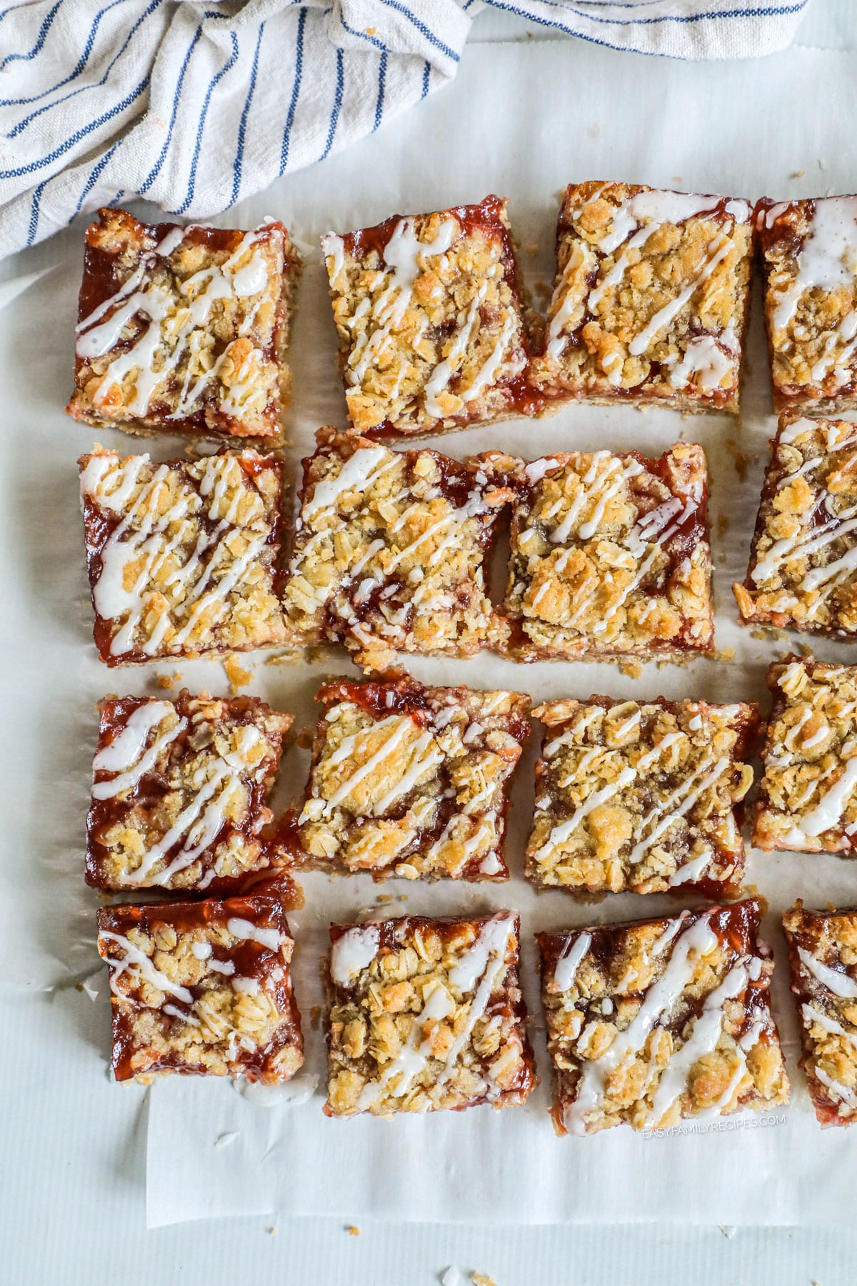 Overhead view of strawberry oatmeal bars cut into squares and glazed