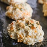 closeup of homemade, baked cheddar bay biscuits.