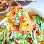 Scooping baked chicken taco casserole from casserole dish