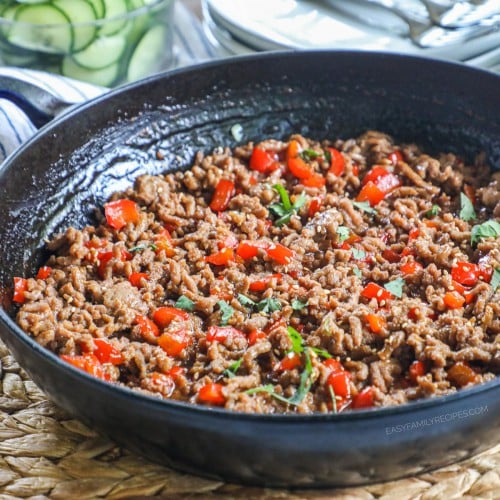 A large skillet of ground turkey and bell peppers cooked in teriyaki sauce.