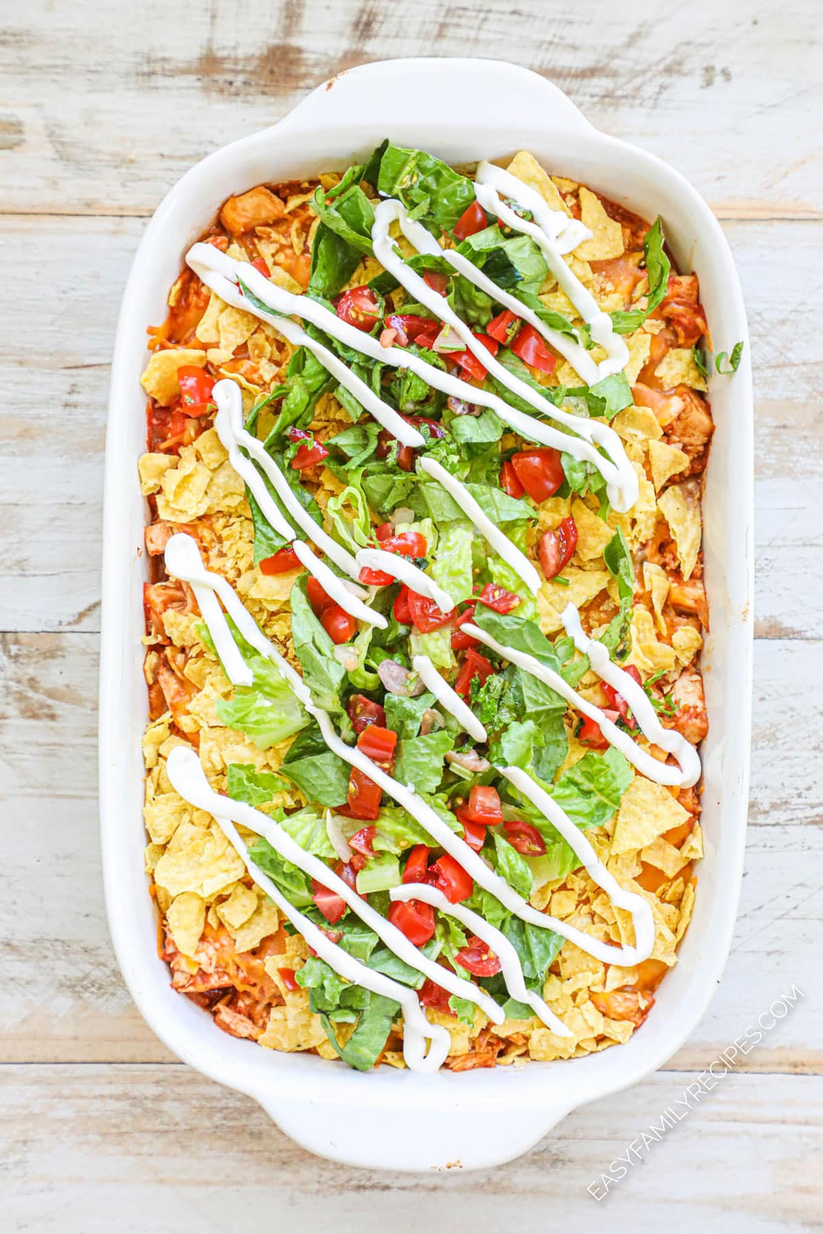 Step 4 How to make chicken taco casserole finish casserole with shredded lettuce, pico de gallo, and sour cream