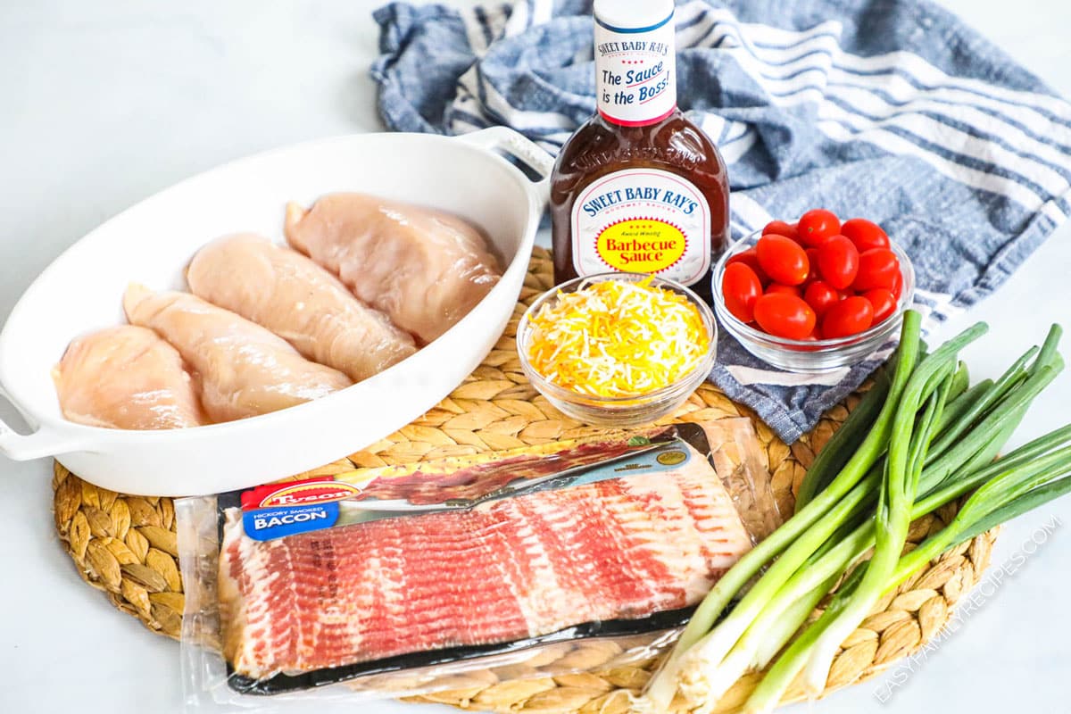 Ingredients for Monterey Chicken including bacon, chicken breast, BBQ sauce, cheese, tomatoes and onions