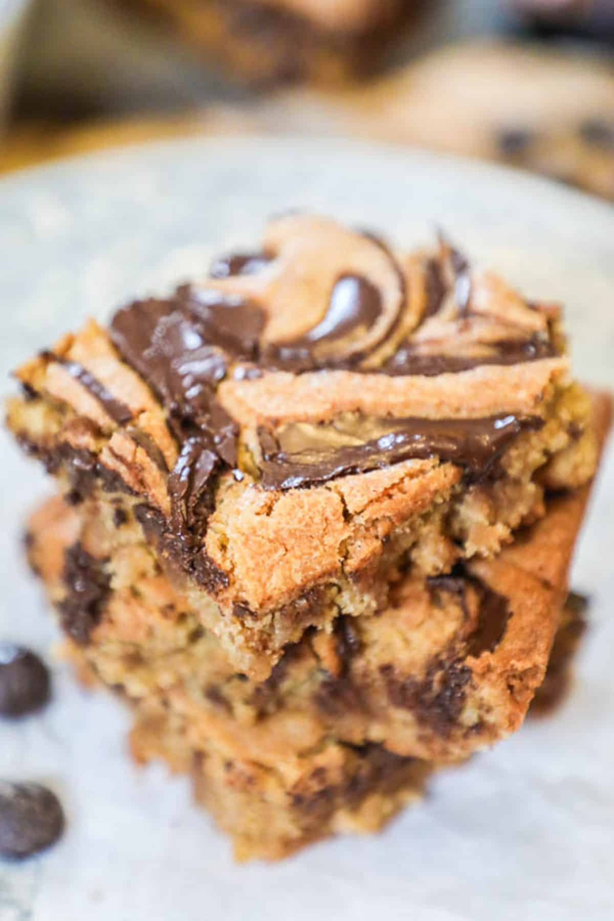 peanut butter swirl bars stacked on top of eachother