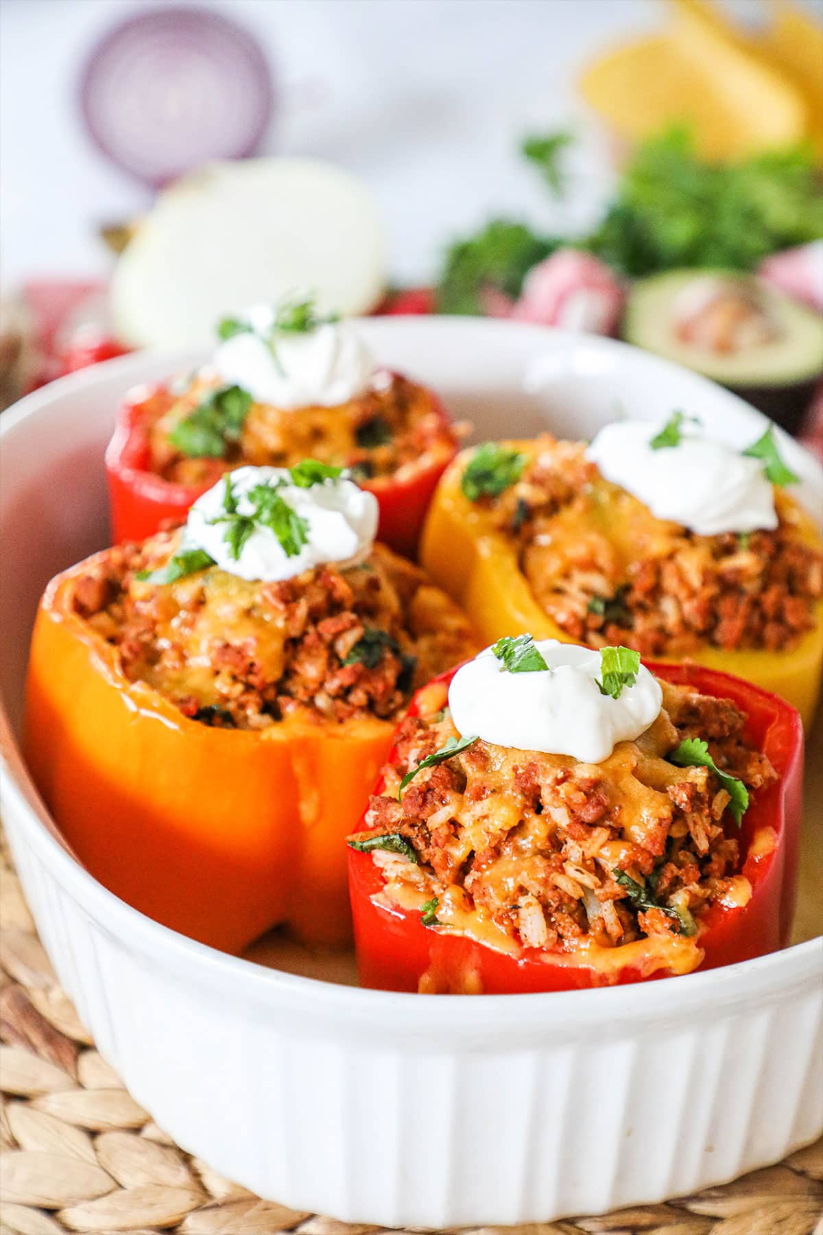 chili stuffed bell peppers with a dollop of sour cream