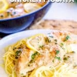 Creamy Chicken Piccata on a plate and garnished with Lemon and parsley.