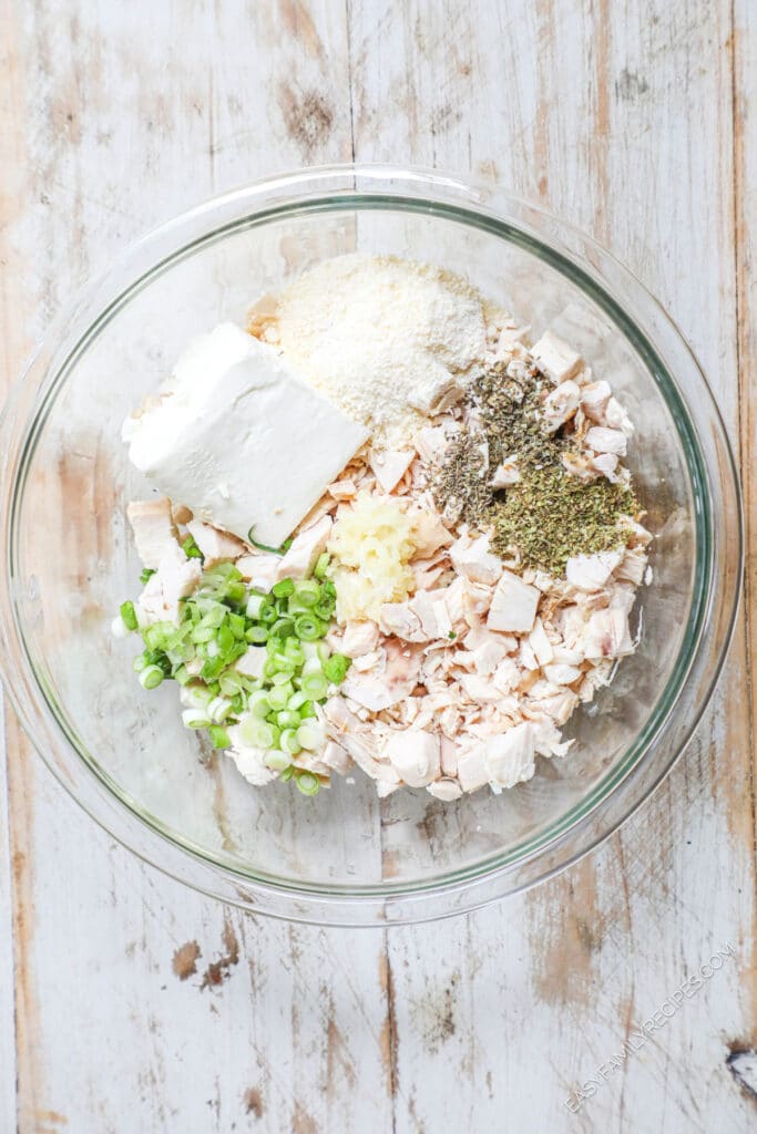 How to Make Chicken Pillows Step 1: Combine shredded chicken with cream cheese, herbs, and parmesan cheese.