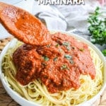 Pin image spooning marinara sauce over spaghetti