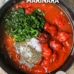 Overhead view of ingredients to make spaghetti marinara in pot