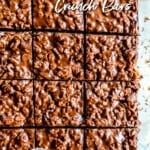Overhead view of dark chocolate crunch bars cut into squares.