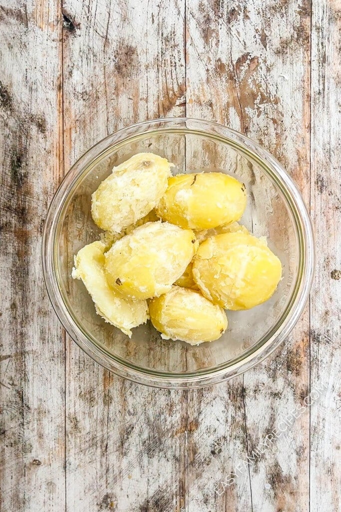 Cooked peeled potatoes in a bowl.
