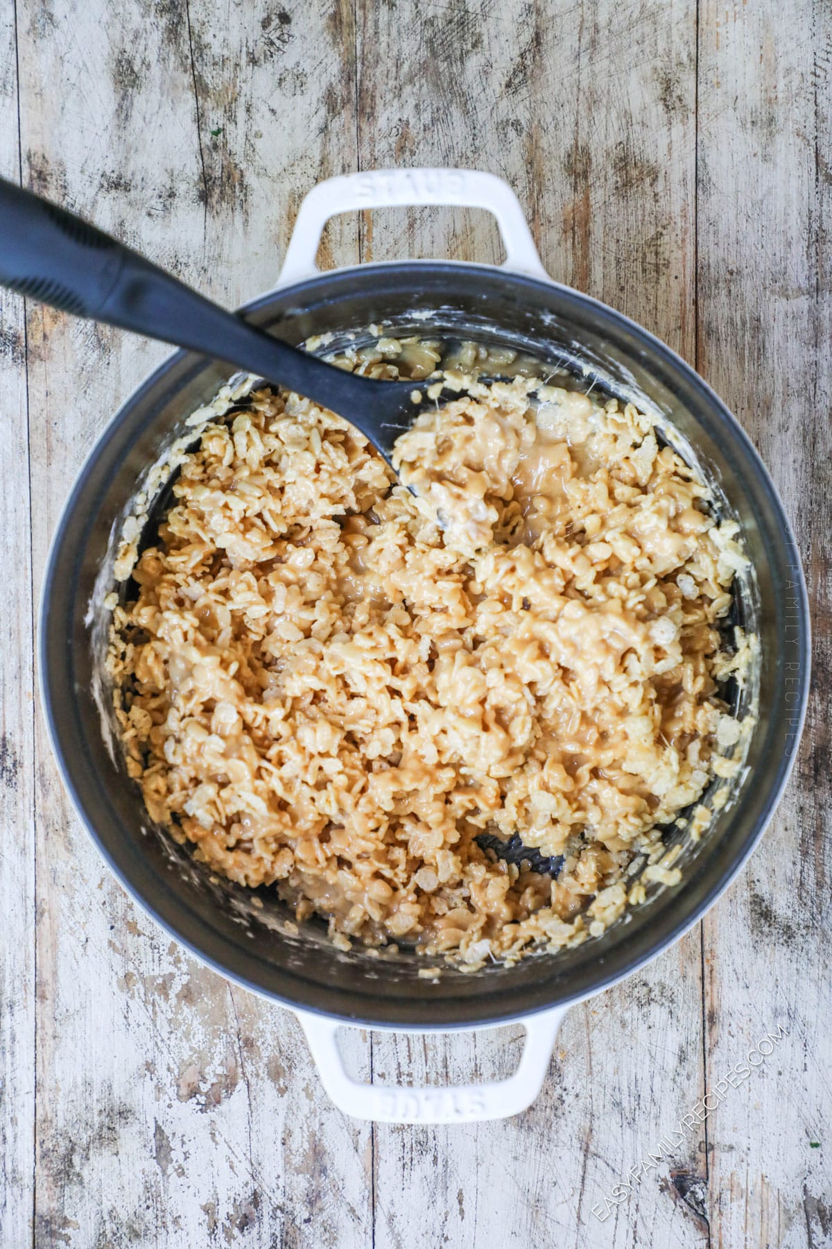 Stirring the Rice Krispies into the pan for Salted Caramel Rice Krispie Treats