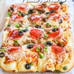 a rectangular baked supreme style pizza.