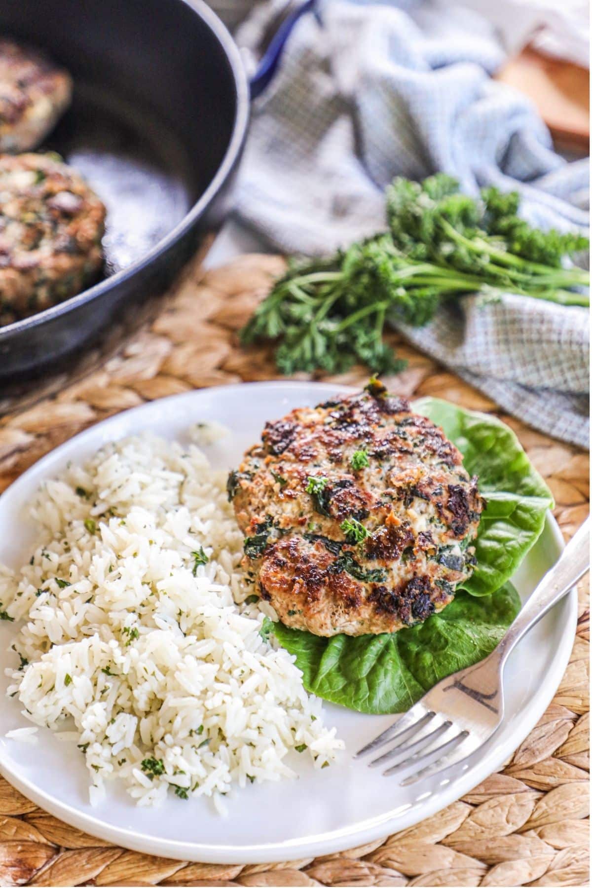 turkey spinach feta burger on a plate with a side of rice