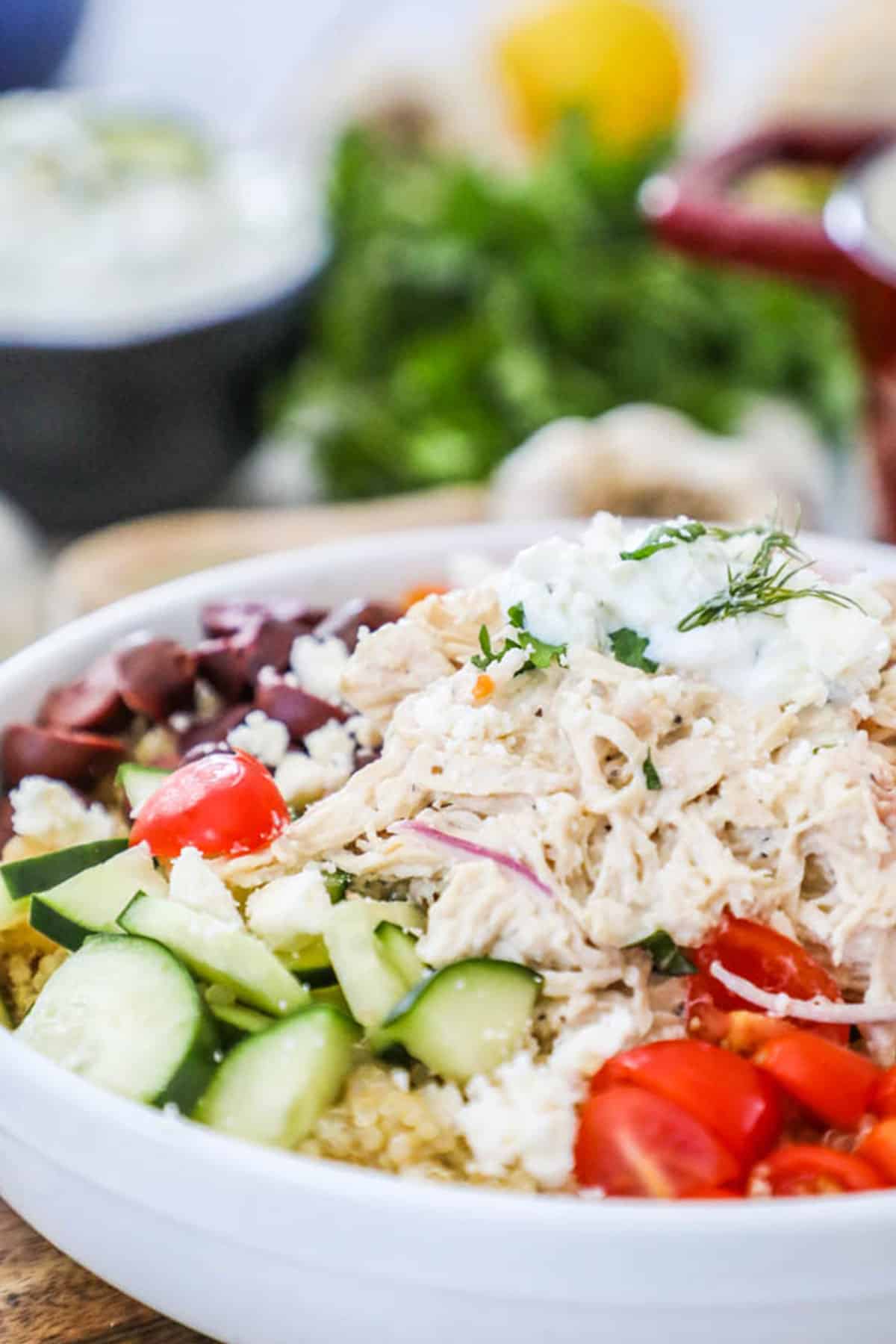 creamy greek chicken salad with tomatoes, olives and cucumbers