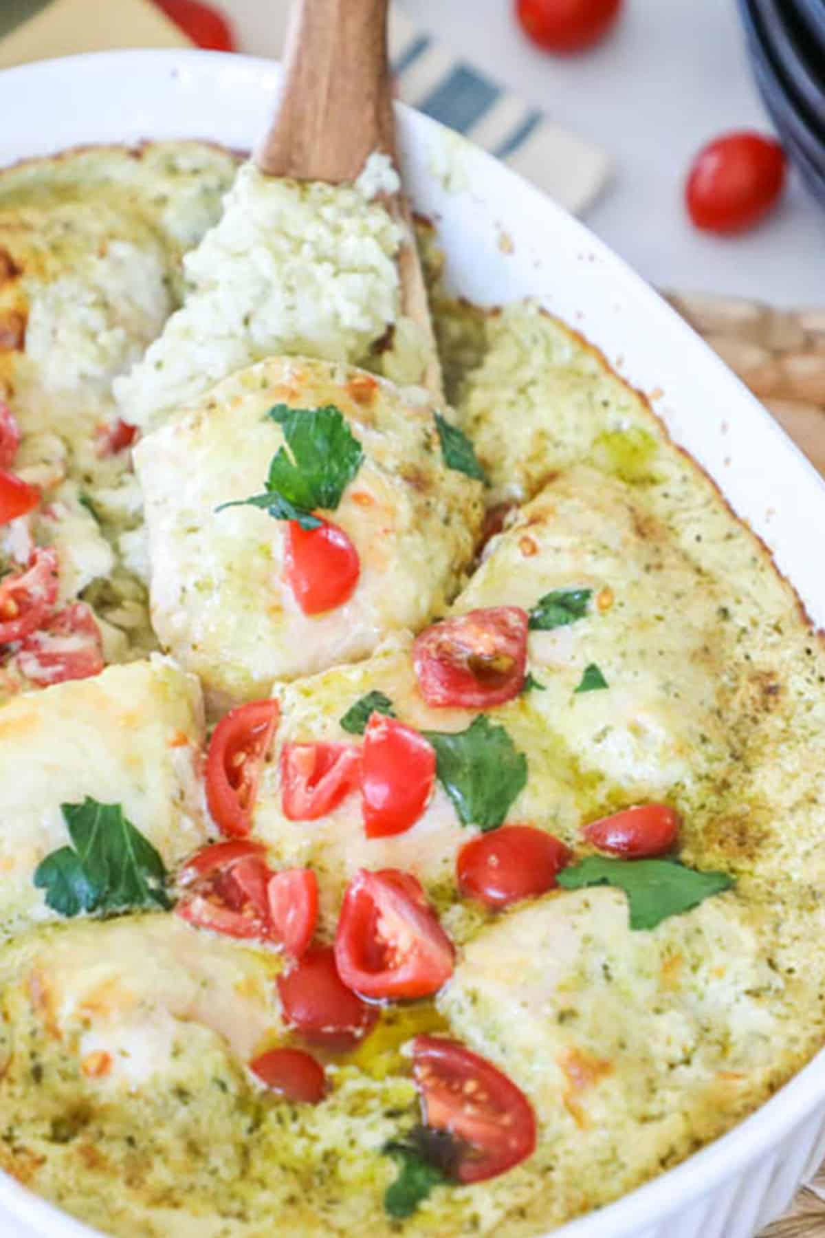 pesto chicken casserole with basil and tomatoes as a garish