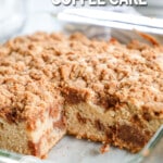 Cinnamon Crumble Coffee Cake in a glass baking pan, with a piece cut out of it. The text reads, "Cinnamon Crumble Coffee Cake."