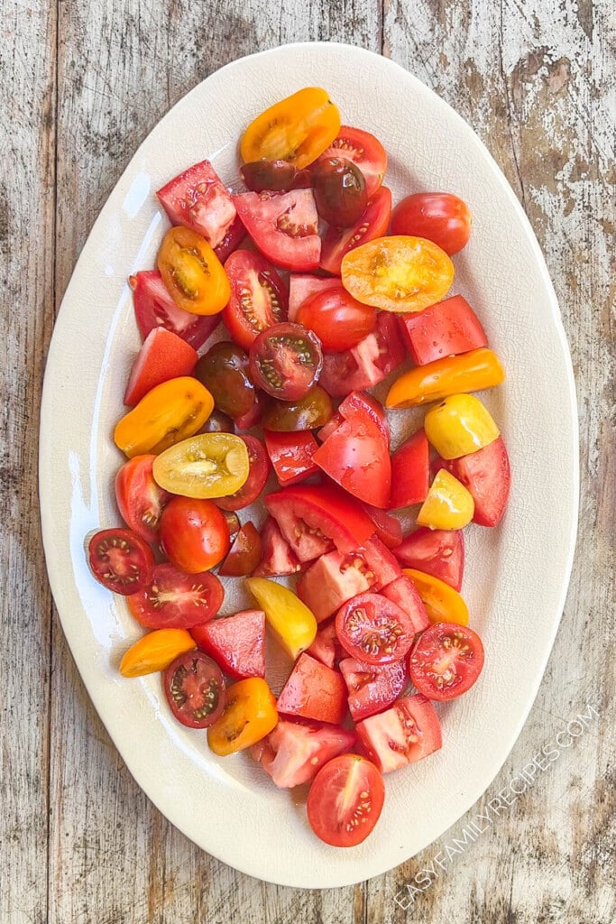 fresh tomato on a platter from above.