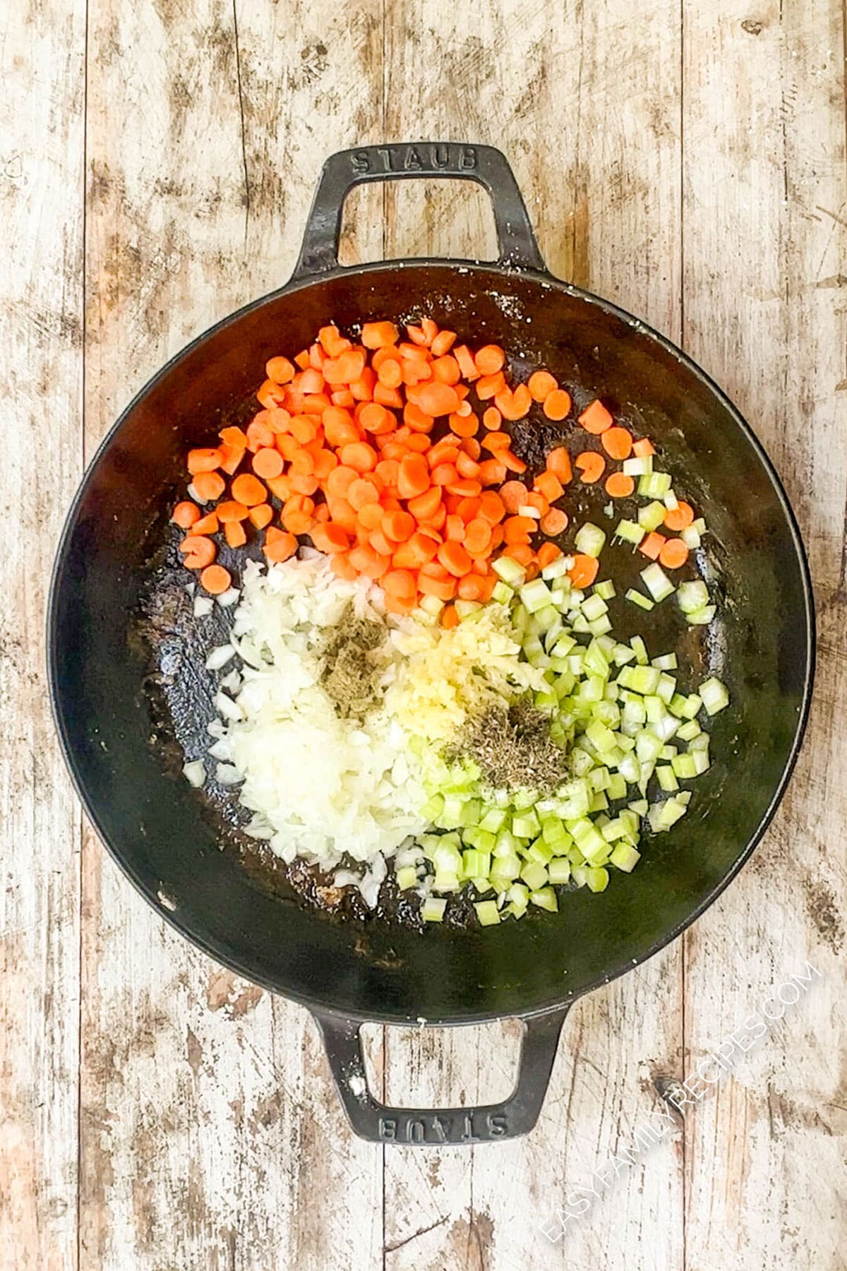 Veggies and aromatics in pan.