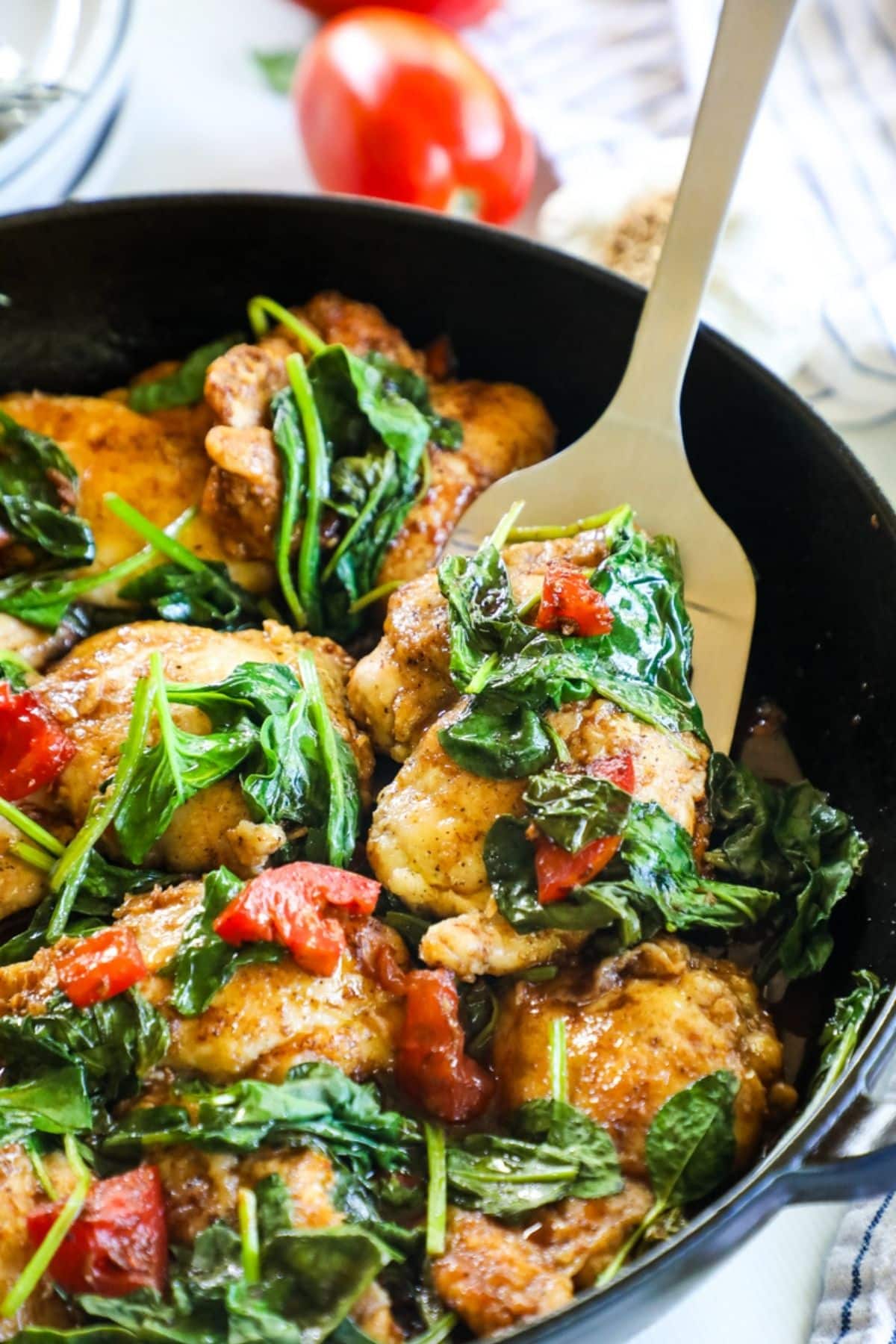 tuscan chicken thighs in a skillet