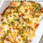 cheesy bacon ranch chicken with broccoli in a white baking dish. The text reads, "Cheesy Bacon Ranch Broccoli Chicken."