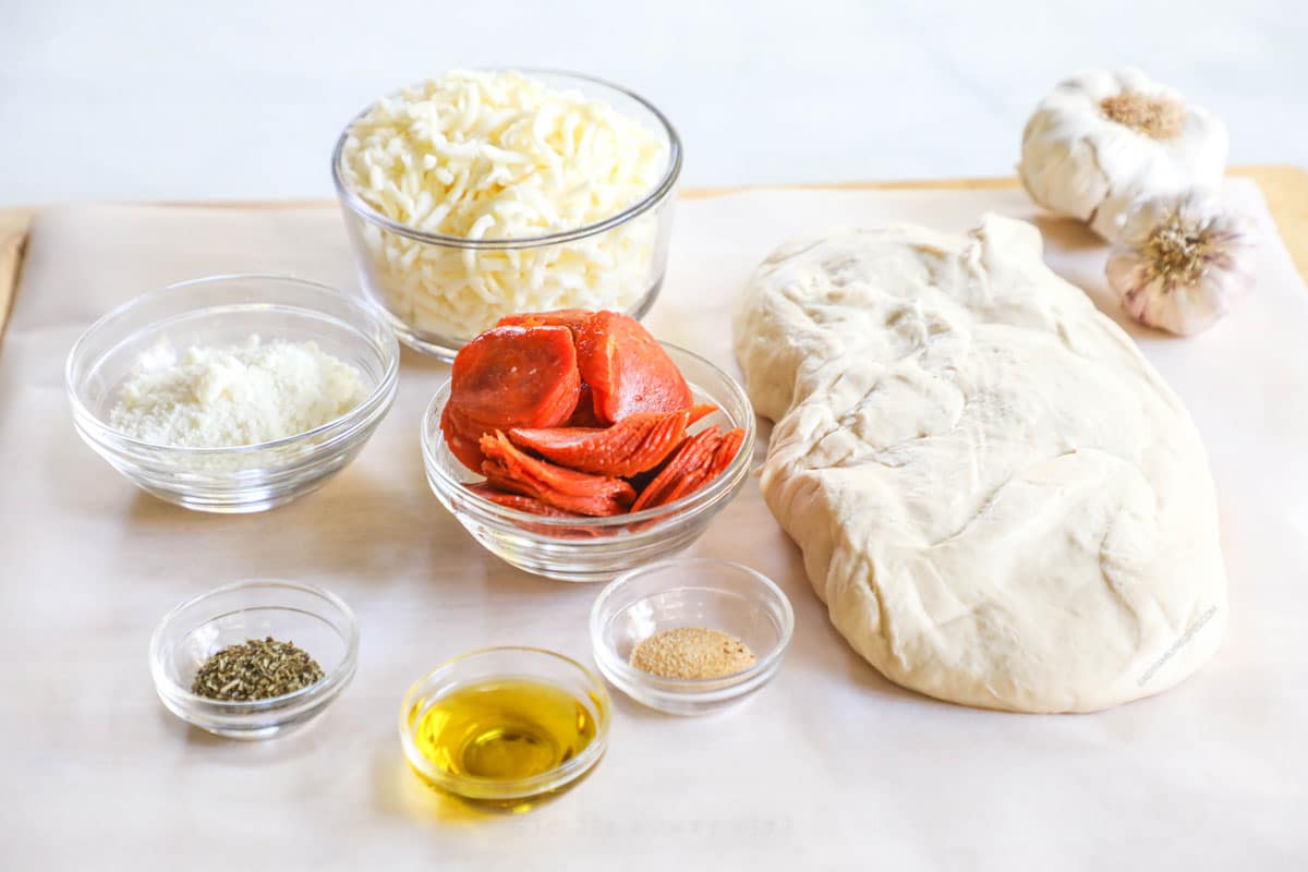 ingredients for pepperoni rolls with pizza dough.