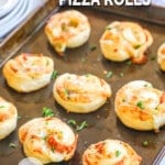 baked pizza crust pepperoni rolls lined on a baking sheet.