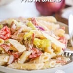 Grinder pasta salad in a white bowl. The text reads, Italian Grinder Pasta Salad.