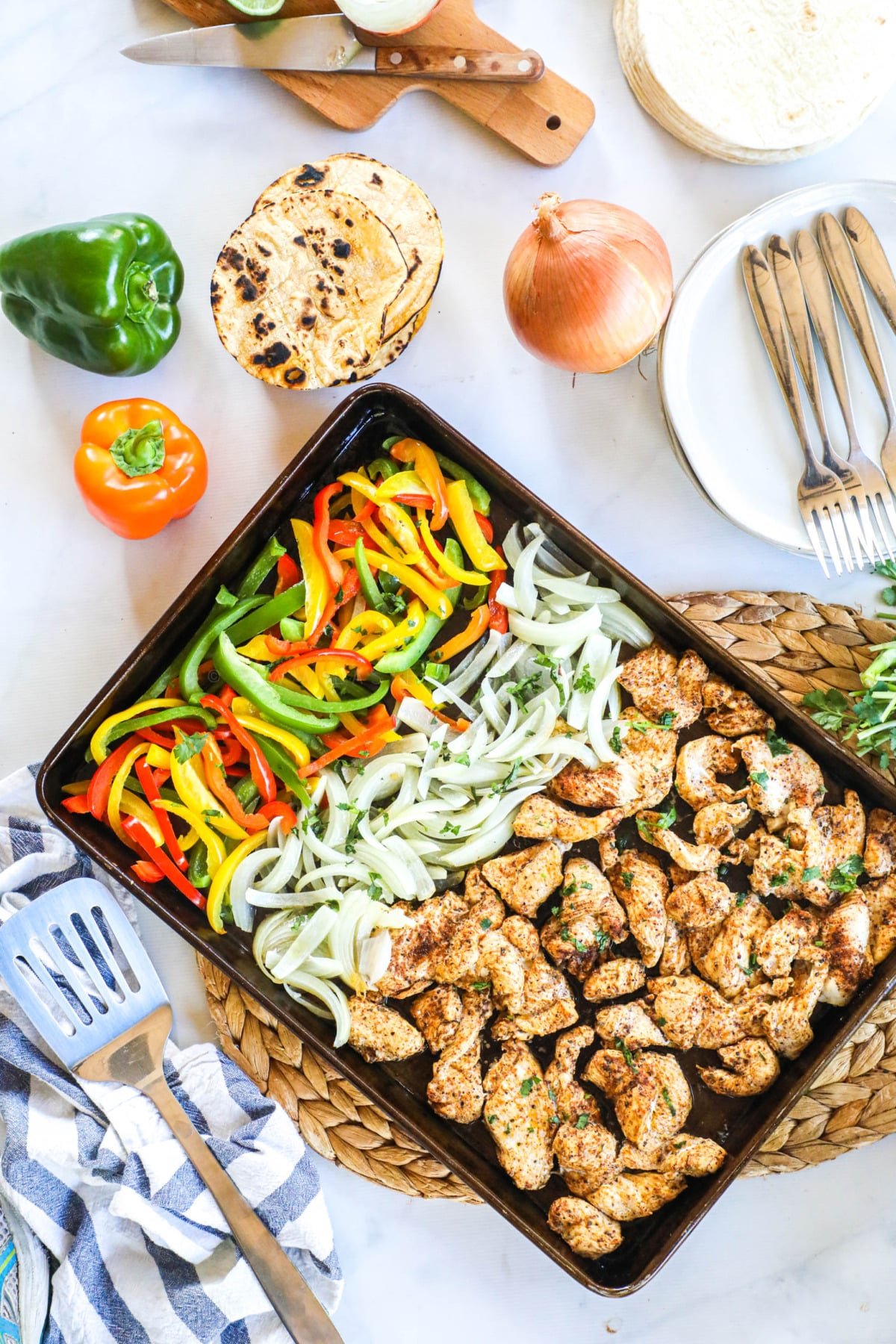 veggies and chicken on a pan for fajitas