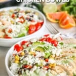 Two chicken baja bowls on a distressed wood background with citrus wedges in the background. The text reads, "Baja Chicken Bowls."