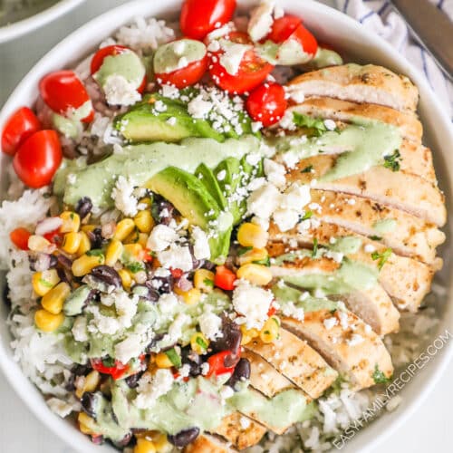 A top view of a baja chicken bowl in a white dish.