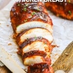 a whole BBQ baked chicken breast sliced.